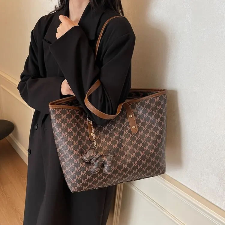 Vegan leather tote with multi-pocket organization for laptop protection