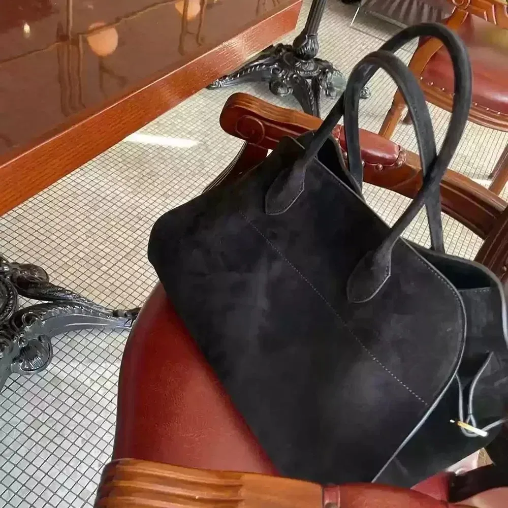 Full grain leather tote with laptop compartment for professional everyday use