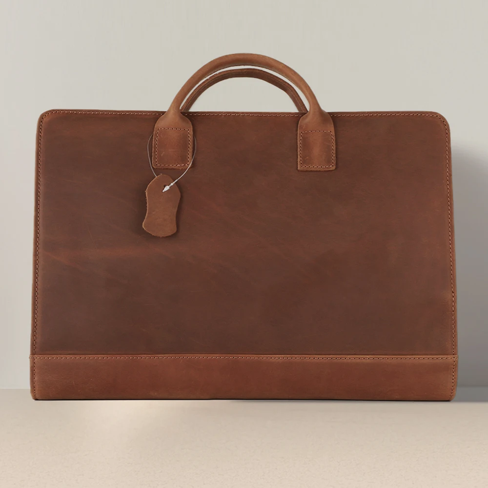 Travel-friendly organized leather briefcase with multiple compartments for business professionals