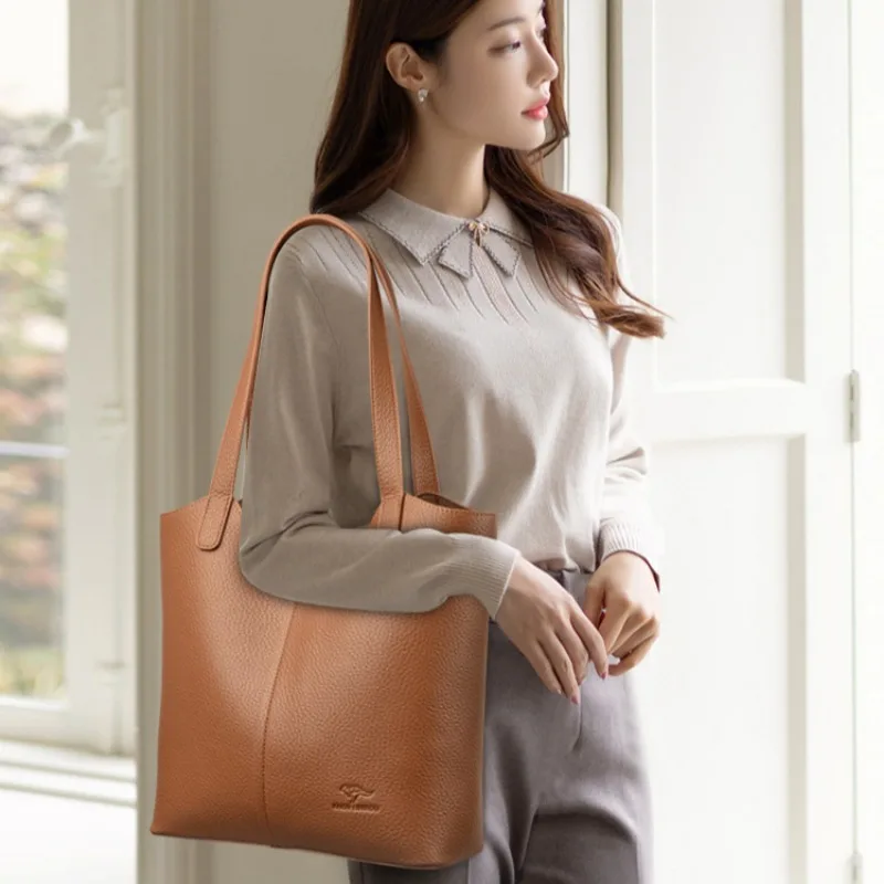 Versatile faux leather work tote with crossbody strap for professional settings