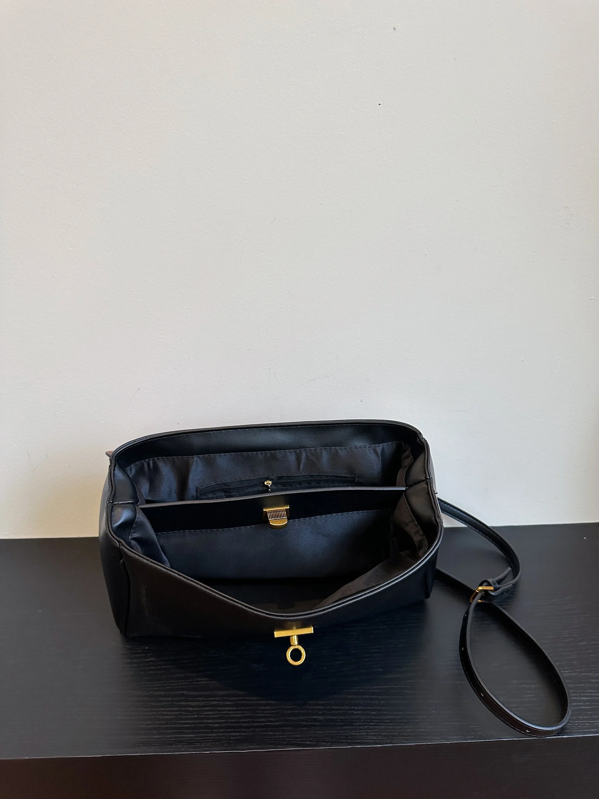 Professional woman matching her outfit perfectly with a structured leather work tote